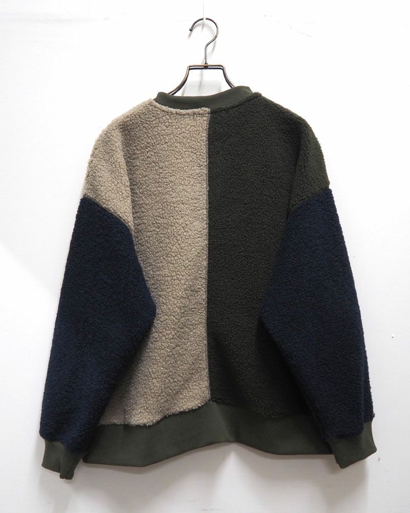 リングドットボタンをあしらった軽量ボアカーディガン。豊富なカラーバリエーションでデイリーに活躍する一枚